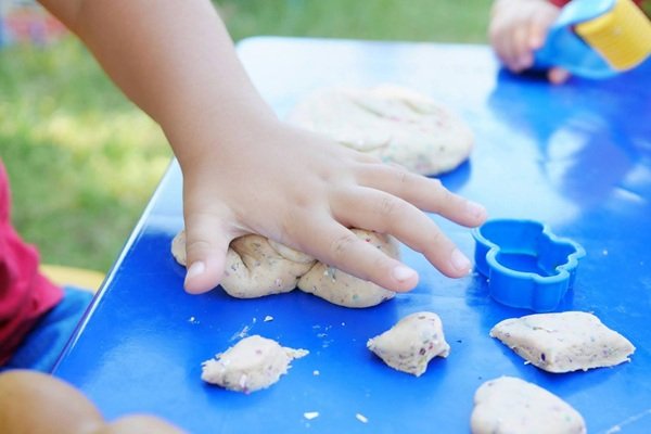 Child's Hand Playing with Clay
